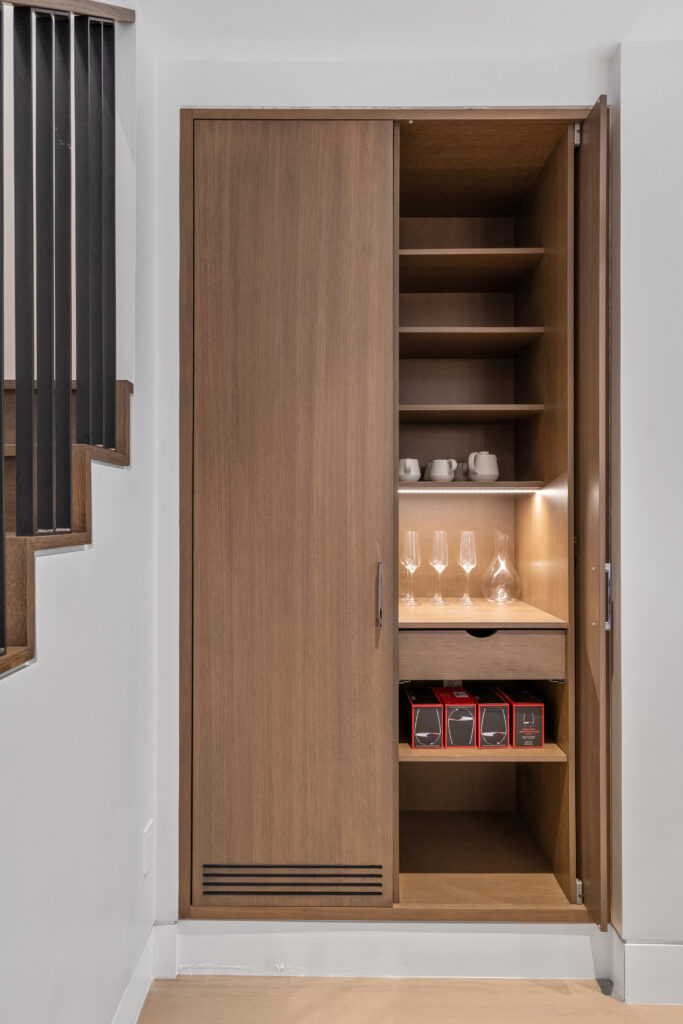 47 Hancock street bar nook; Renovated kitchen at 47 Hancock Street, designed by ArnoldAnd to balance historic brownstone charm with modern functionality. Custom millwork and built-in storage solutions at 47 Hancock Street by ArnoldAnd. Reconfigured floor plan enhancing flow and functionality in this Boston brownstone renovation by ArnoldAnd.