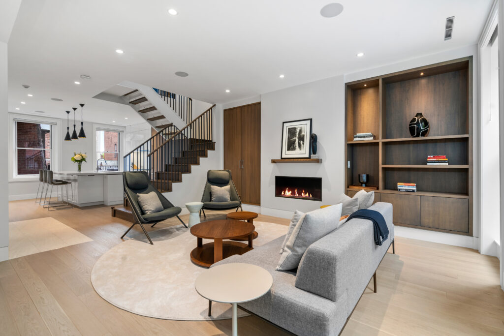 47 Hancock street view of kitchen from living room; Renovated kitchen at 47 Hancock Street, designed by ArnoldAnd to balance historic brownstone charm with modern functionality. Custom millwork and built-in storage solutions at 47 Hancock Street by ArnoldAnd. Reconfigured floor plan enhancing flow and functionality in this Boston brownstone renovation by ArnoldAnd.