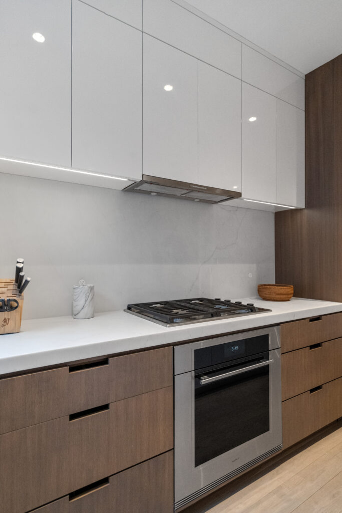 47 Hancock street kitchen detail stove and hoodRenovated kitchen at 47 Hancock Street, designed by ArnoldAnd to balance historic brownstone charm with modern functionality. Custom millwork and built-in storage solutions at 47 Hancock Street by ArnoldAnd. Reconfigured floor plan enhancing flow and functionality in this Boston brownstone renovation by ArnoldAnd.